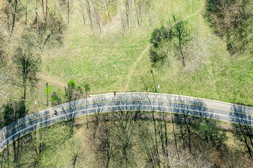 walking and cycling pathway in the park at early spring. aerial top view from flying drone. - 766076939