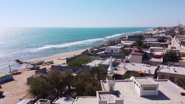 aerial shot on tropical city landscape the seaside town coastal rural village countryside beach bungalow cottage in summer season in tourist destination in Saudi travel guide Islamic local community