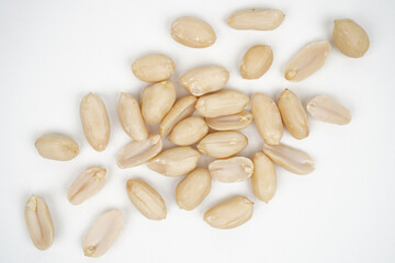 Group of roasted peeled peanuts isolated background