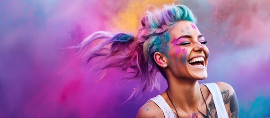 An upbeat woman with colorful hair and tattoos is smiling while holding a mobile device - obrazy, fototapety, plakaty