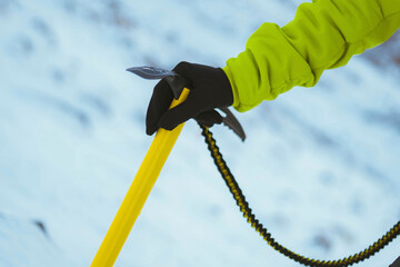 Yellow ice axe in the snow