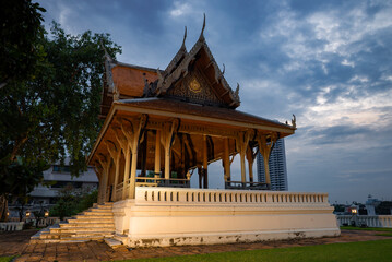 Old wooden Buddhist temple on a cloudy evening. Santi Chai Prakan City Park. Bangkok, Thailand - 766104135