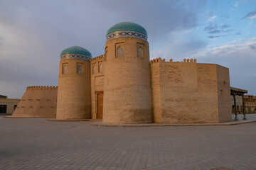 Restored city gates of old Khiva in the early September morning. Uzbekistan - 766114391