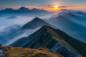 Majestic sunrise over misty mountain peaks with a clear sky.
