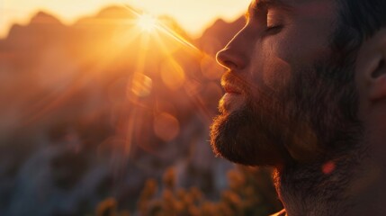 Man embracing the warmth of the sunset in a moment of peaceful contemplation.