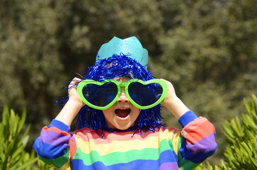 Child at a carnival. Masquerade in kindergarten, at school. Children celebrate Purim, Halloween,...