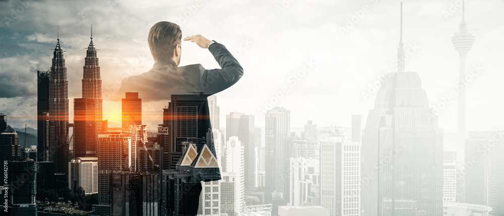 Poster abstract image of businessman looking into the distance on bright wide toned city background with mo