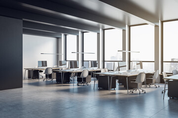 Clean coworking office interior with concrete flooring, furniture and panoramic windows with city view. 3D Rendering.
