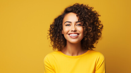 A happy Hispanic woman in her 30s smiling brightly