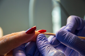 Manicure process in beauty salon, close up