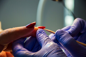 Manicure process in beauty salon, close up