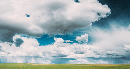 Countryside Rural Field Meadow Landscape In Sunny Rainy Spring Day. Scenic Sky With Rain Clouds On Horizon. Agricultural And Weather Forecast Concept. Panorama. - 766170763
