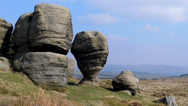 On Bride Stones Moor or hill above Todmorden in West Yorkshire, UK there is an interesting nature's creation - The Bridestones sculptured by weather over the ages and ongoing erosion. Well worth visit