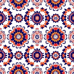 Fototapeta na wymiar A seamless pattern inspired by traditional ethnic designs with stylized floral motifs in a bold red and blue color scheme, ideal for cultural themes.