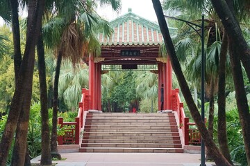 Traditional Asian bridge surrounded by green trees during the daytime in China, Liuhuahu Park - Powered by Adobe