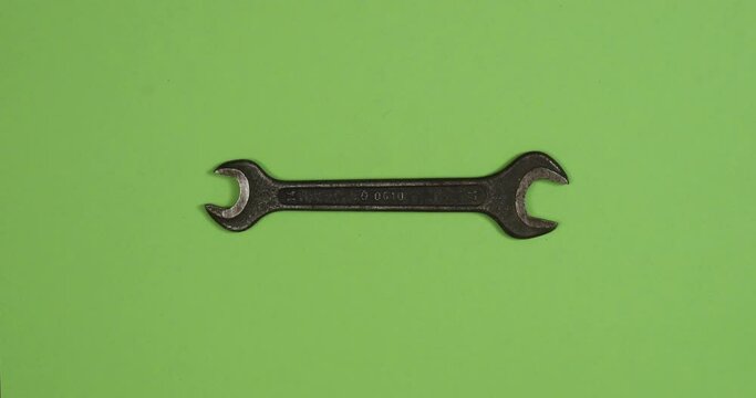 Vintage wrenches changing on color background. Loopable stop motion animation. 4K top view. DIY video concept.