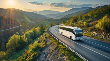 A white bus is driving down a road with mountains in the background - 766199597