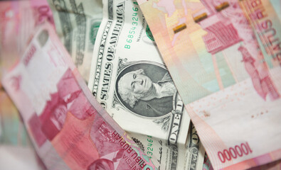 Indonesian banknotes with US dollars.
