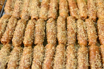 Foto auf Glas Marrakech Morocco Food Traditional sweet pastries coated with sesame seeds and honey. © Richard