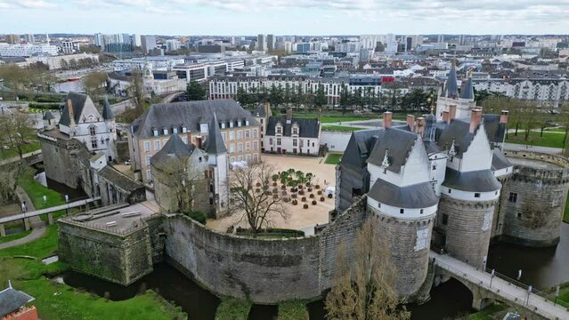 Castle of Dukes of Brittany, Nantes in France. Aerial tilt-up and cityscape