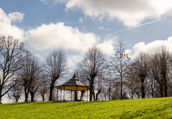 Wooden bandstand or pavilion in a public park - obrazy, fototapety, plakaty