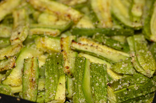 baked zucchini cut into sticks with sesame seeds cooked in the oven 1