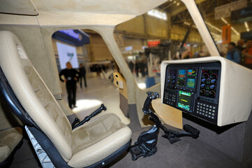 cockpit of a light passenger helicopter. pilot seat, dashboard, steering wheel