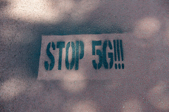 Amsterdam The Netherlands May 2020. &ldquo;Stop 5G&rdquo; spray painted onto a cycle path. Some see 5G networks as a health risk with some attributing the corona virus outbreak to it.