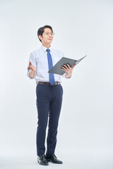 A young office worker man wearing a suit and glasses is holding a document file and posing with a variety of confident expressions.