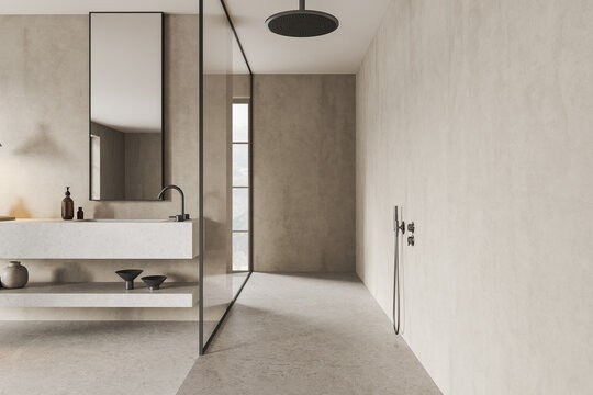 Stylish hotel bathroom interior with sink and shower with panoramic window