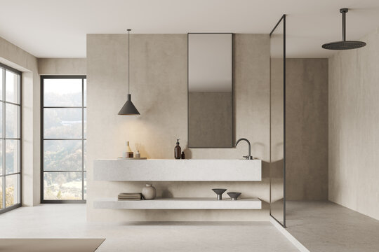 Beige hotel bathroom interior with washbasin and shower with panoramic window