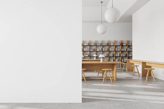 White library interior with bookshelf and work desk with seat, mock up wall