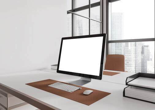 White coworking interior with pc computer on table with mockup display, window