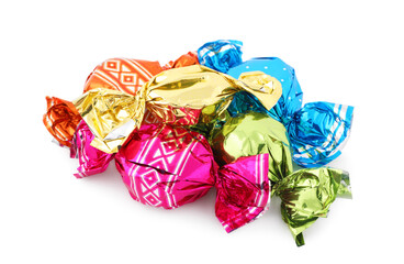 Pile of sweet candies in colorful wrappers on white background