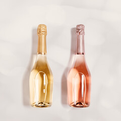 Top view sparkling rose and white wine, bottle of wine with sunlight flare on beige background, copy space.  Festive Summer alcohol drinks concept, happy holidays beverage wallpaper, pastel