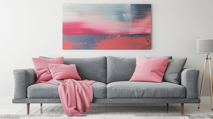Pink pillows and Grey sofa, blanket against white wall with abstract art poster. Interior design of modern living room, wall with abstract art poster