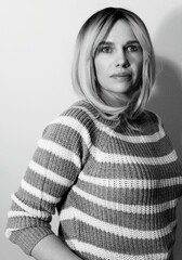 Portrait of a beautiful woman in a sweater - black and white photo