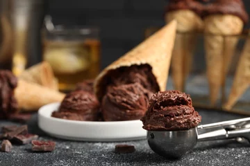 Badezimmer Foto Rückwand Tasty ice cream scoops, chocolate crumbs and waffle cones on dark textured table, closeup © New Africa