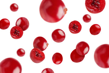 Fresh red cranberries falling on white background
