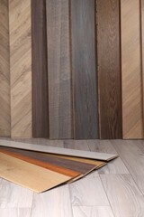 Different samples of wooden flooring on surface