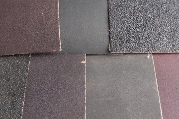 Many sheets of sandpaper as background, top view - obrazy, fototapety, plakaty