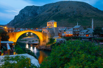 Mostar, Bosnia and Herzegovina. The Old Bridge, Stari Most, with emerald river Neretva. - obrazy, fototapety, plakaty