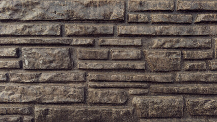 Fragment of an brick wall as a background or texture. Structure of a stone wall