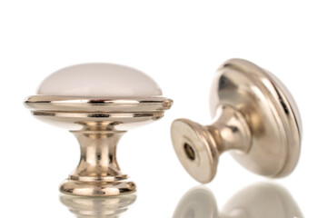 Two metal handles for furniture, macro, isolated on white background.