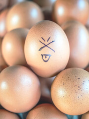 A chicken egg is drawn with lines expressing the feeling of  funny face