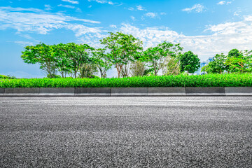 Empty asphalt road and woods background