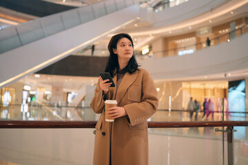 Stylish Woman Navigating Shopping Mall with Ease