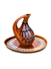 Ceramic vase on a tray, retro clay jug in oriental style culture