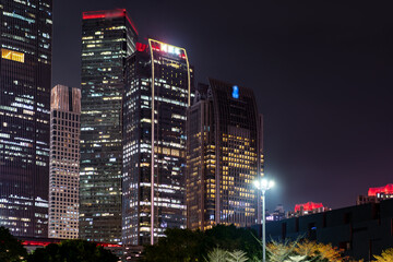 Majestic City Skyline at Night with Illuminated Buildings