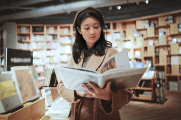 Young Woman Enjoying Literature in Cozy Bookstore